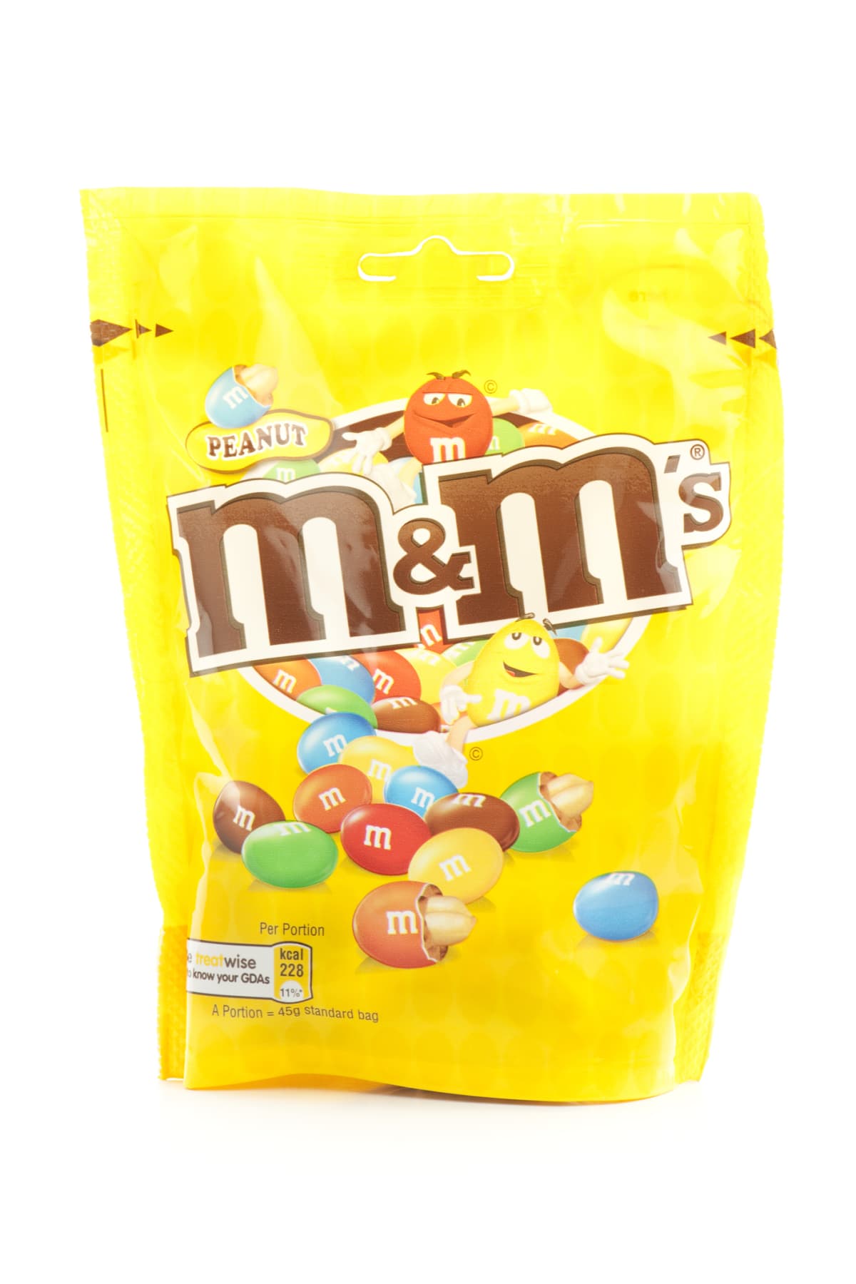 Weybridge, England-April 11, 2011.  Large bag of Peanut M and Ms on a white background.  M and M's are sold by Mars co. which is a family owned company that is almost 100 years old.  M and Ms were first introduced in 1941 as a way to sell chocolate in warm locations.  They melt in your mouth, not in your hands.