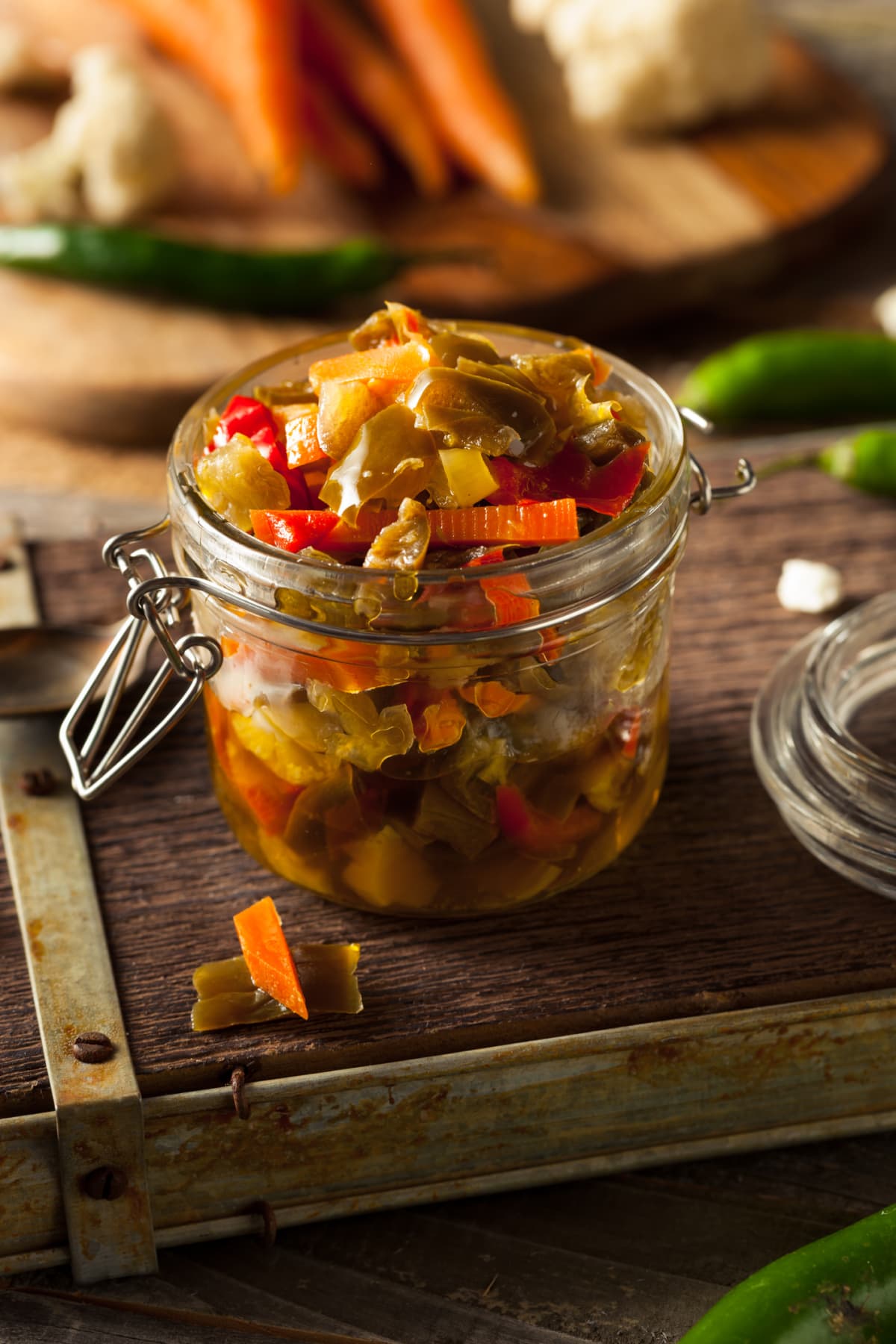 Giardiniera - relish of pickled vegetables in vinegar closeup. vertical view from above