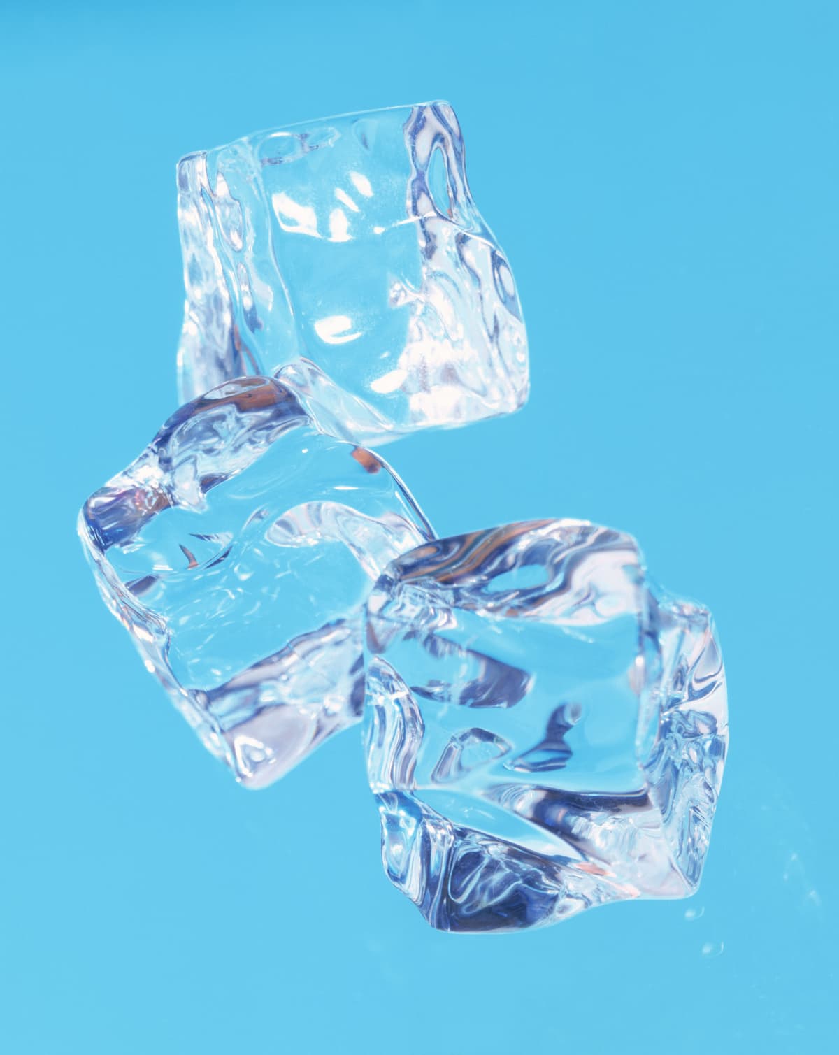 Falling ice cubes on a blue background