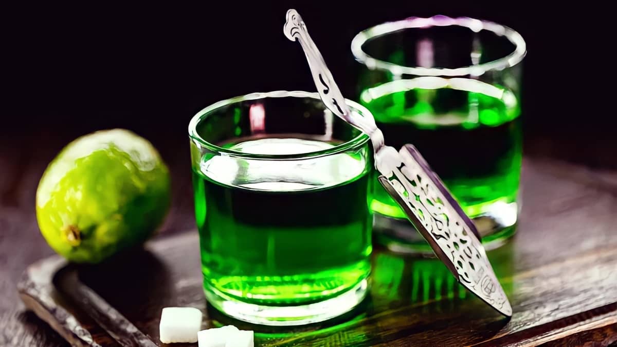 Two glasses of green absinthe