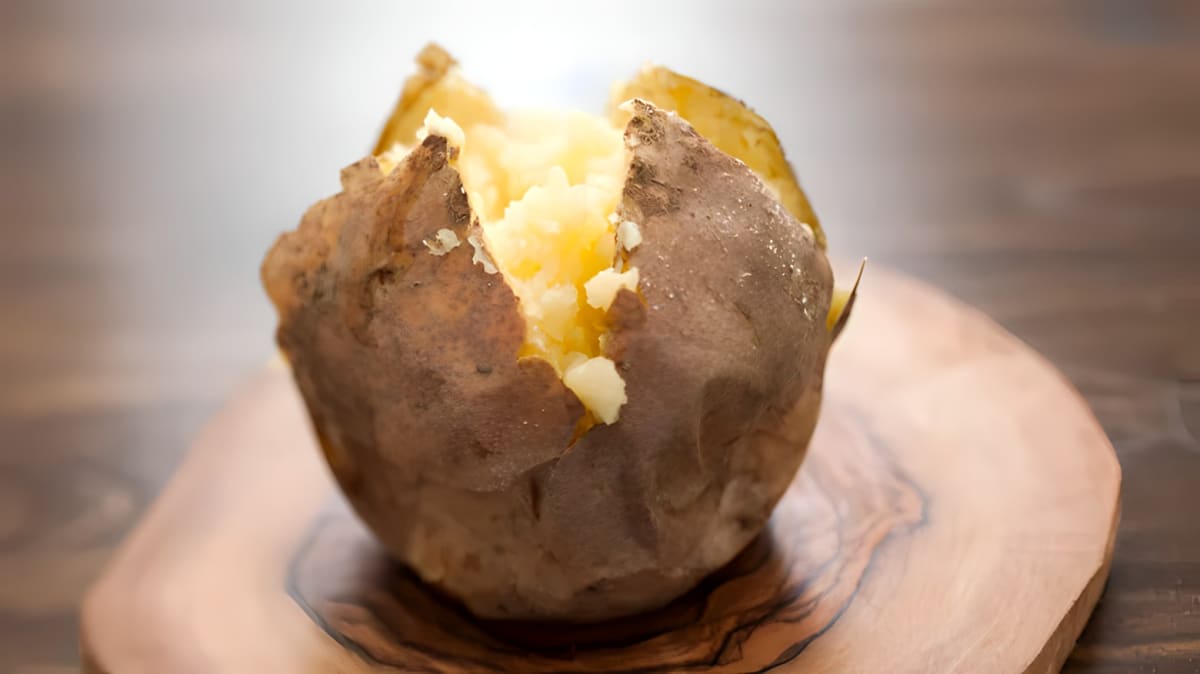 Close up of scored baked potato