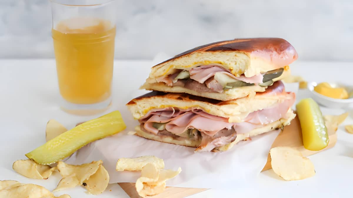 Two halves of a Cuban sandwich stacked on top of each other