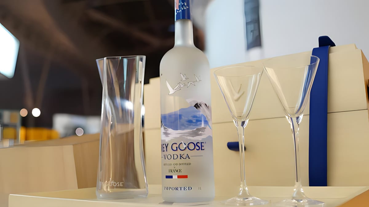 Bottle of Grey Goose vodka and cocktail glasses