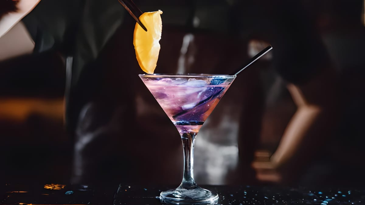 Martini glass of a purple haze cocktail