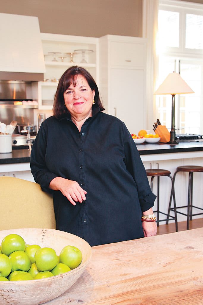 Ina Garten posing for a photo in her home kitchen