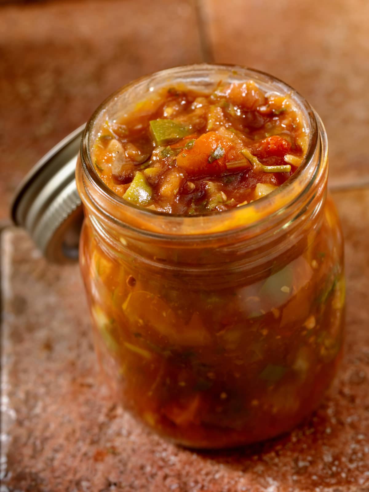A jar of salsa on a countertop