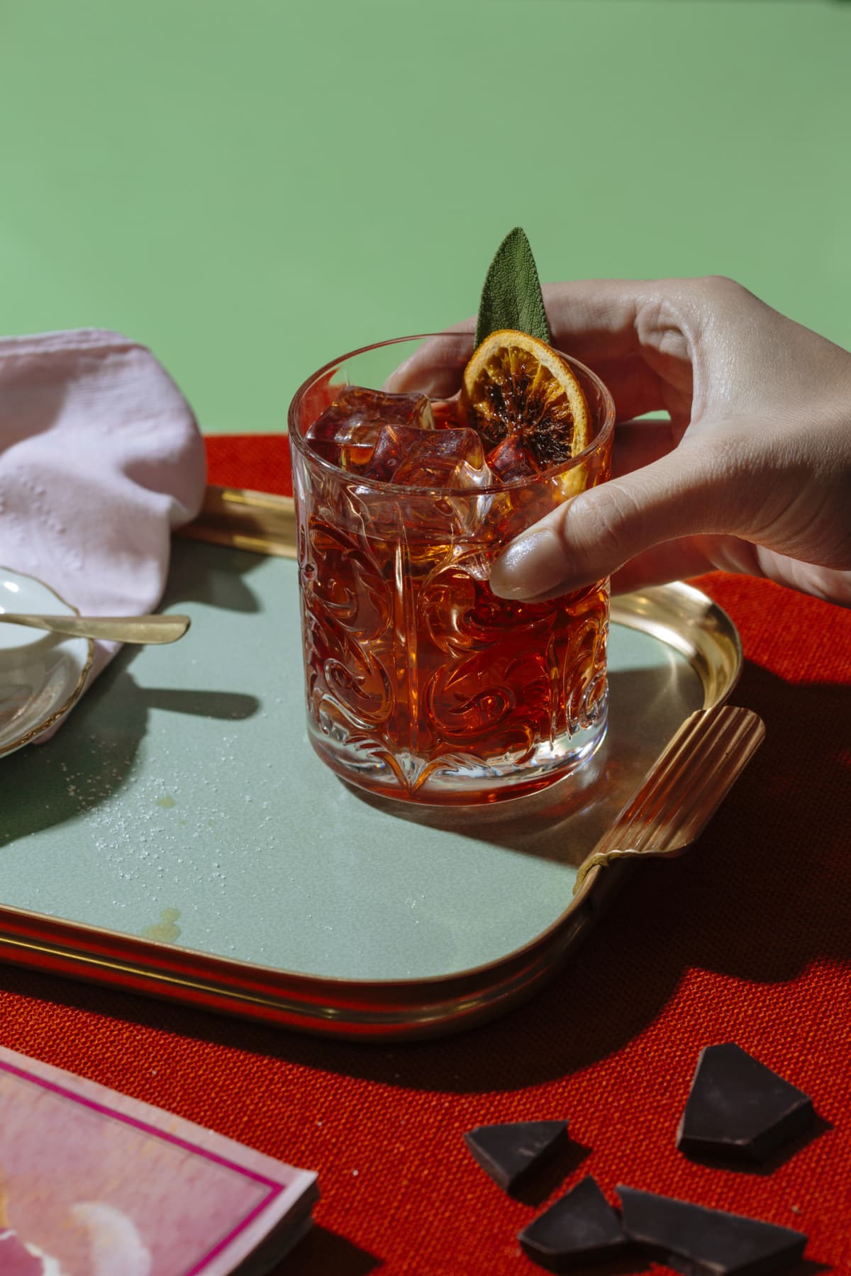 Negroni cocktail being held by a hand