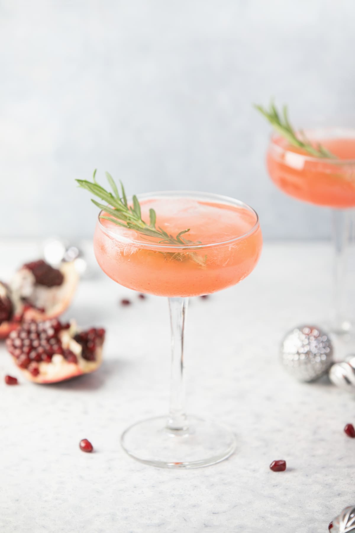 Winter holidays festive alcohol pomegranate drink concept, front view