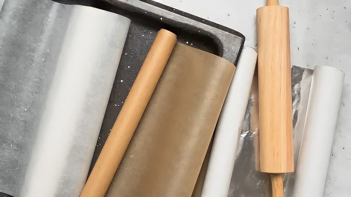 Parchment paper rolled up on a pan