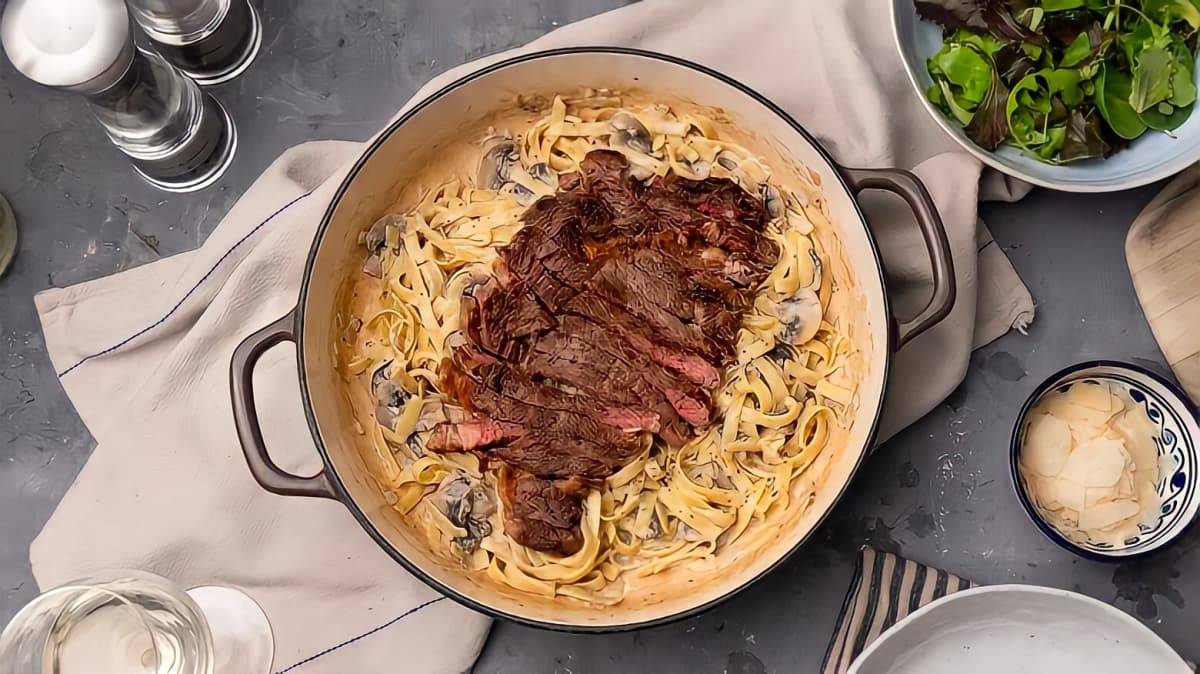 Steak on top of pasta
