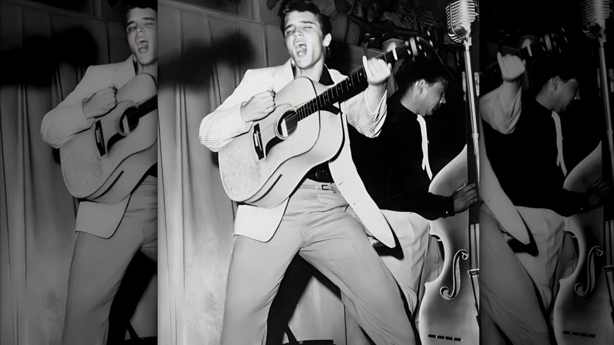 black and white photo of Elvis Presley performing