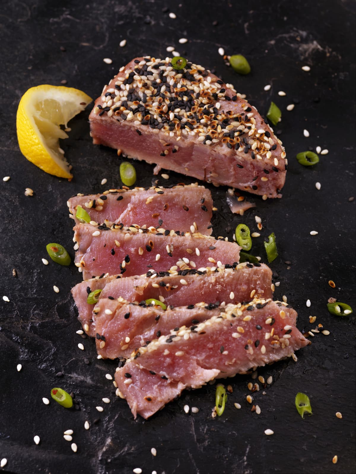 Fresh raw tuna steak isolated on white background.