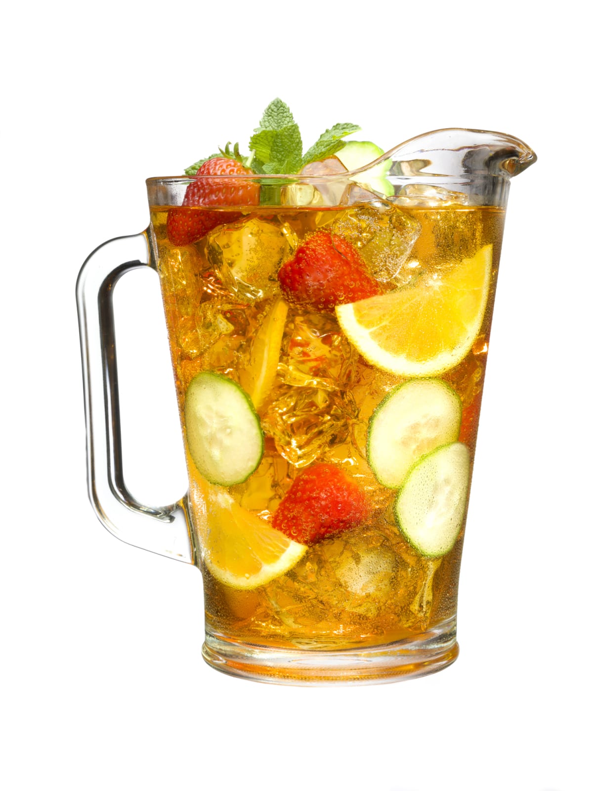 Pitcher of iced tea with cucumber, lemon, strawberry, and mint