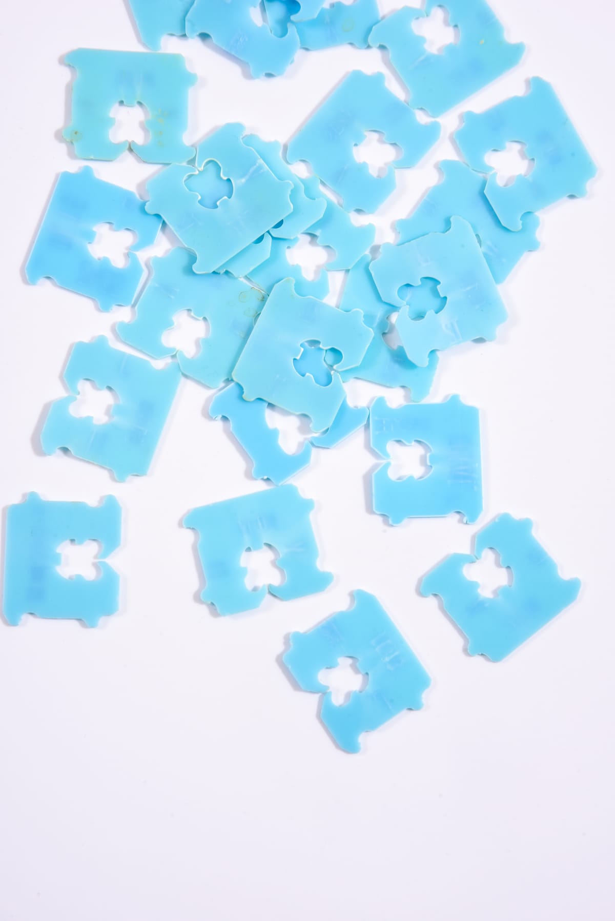 Blue tag bread clips on white background
