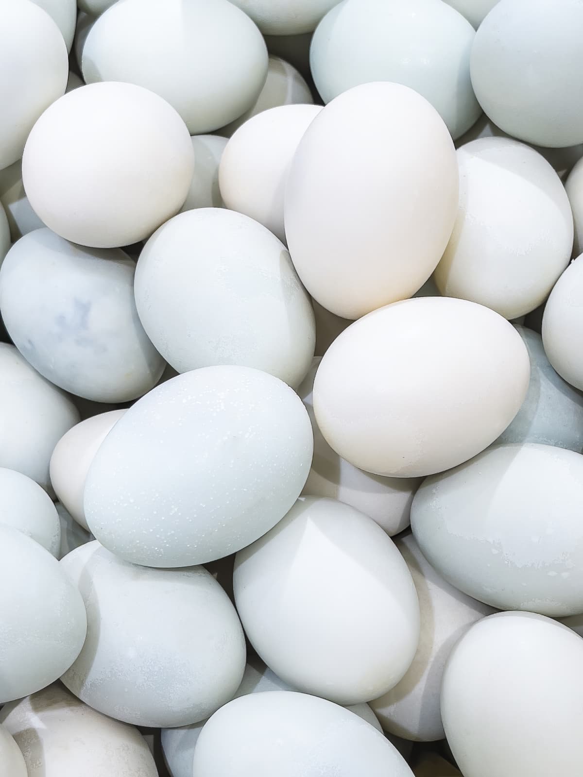 Abstract pattern of irregularly stacked duck eggs