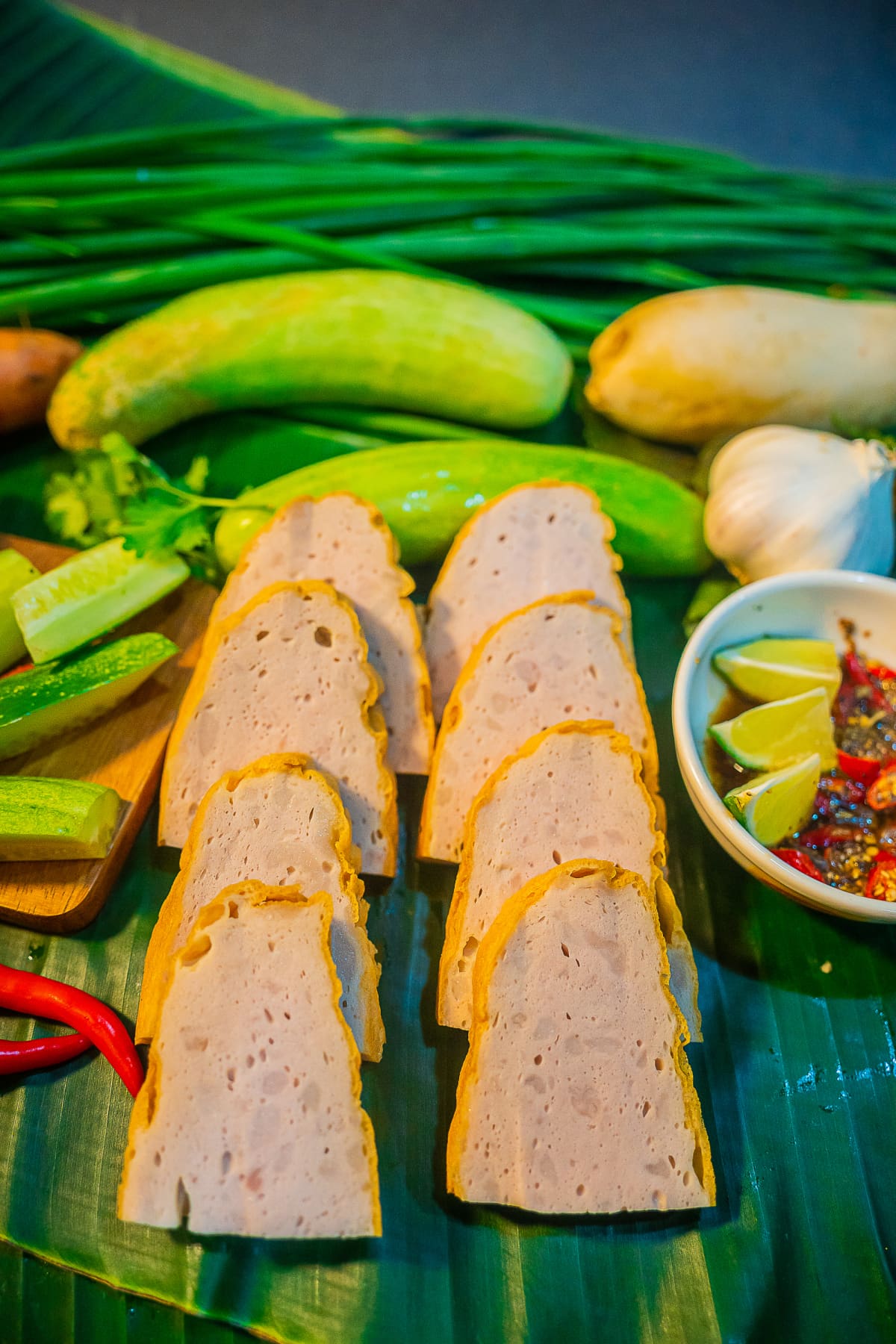 Traditional Vietnamese food, pork sausage or pork bologna with pepper, lemon and salt sauce on colorful background. Selective focus.