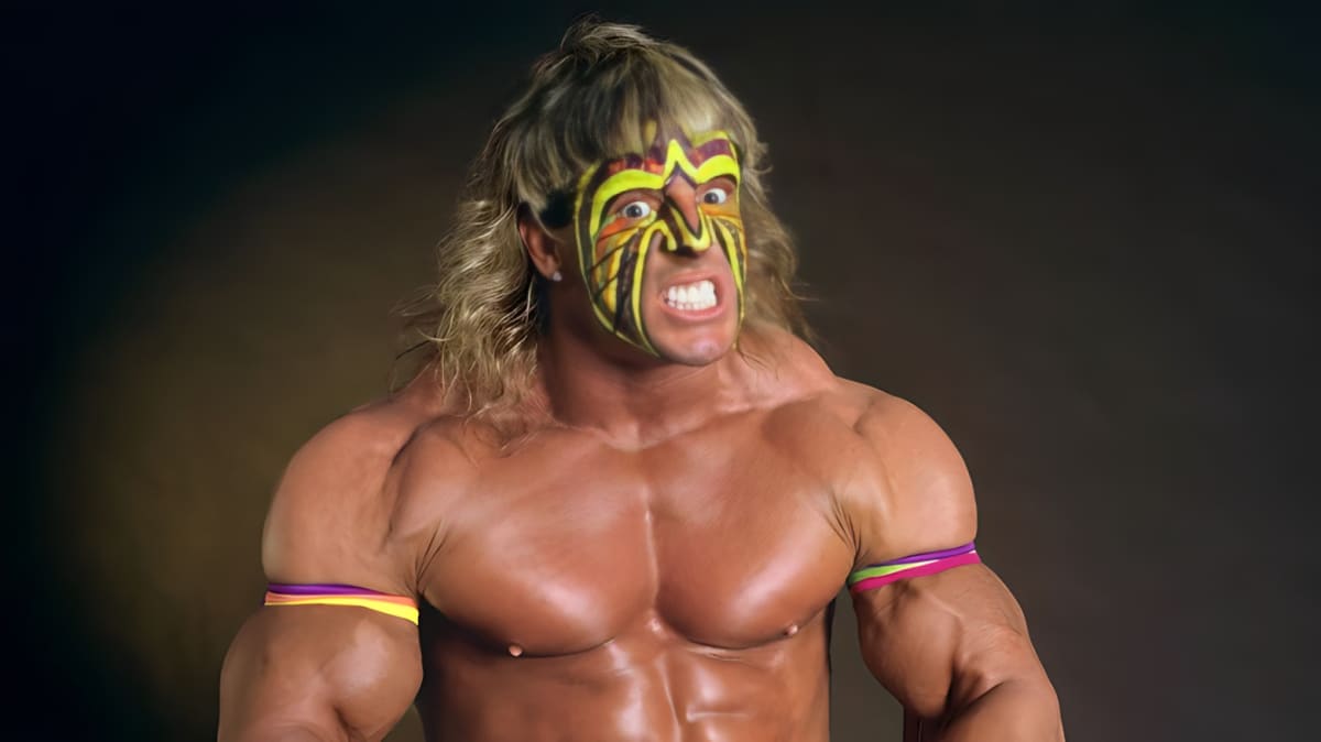 The Ultimate Warrior flexing