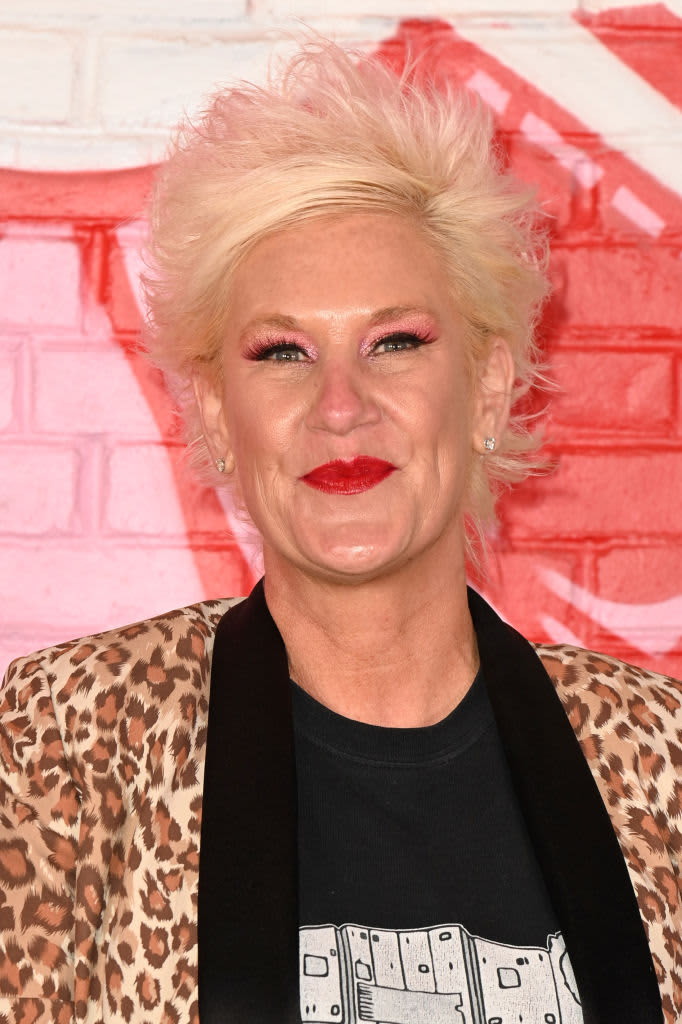 Anne Burrell smiling with leopard print jacket