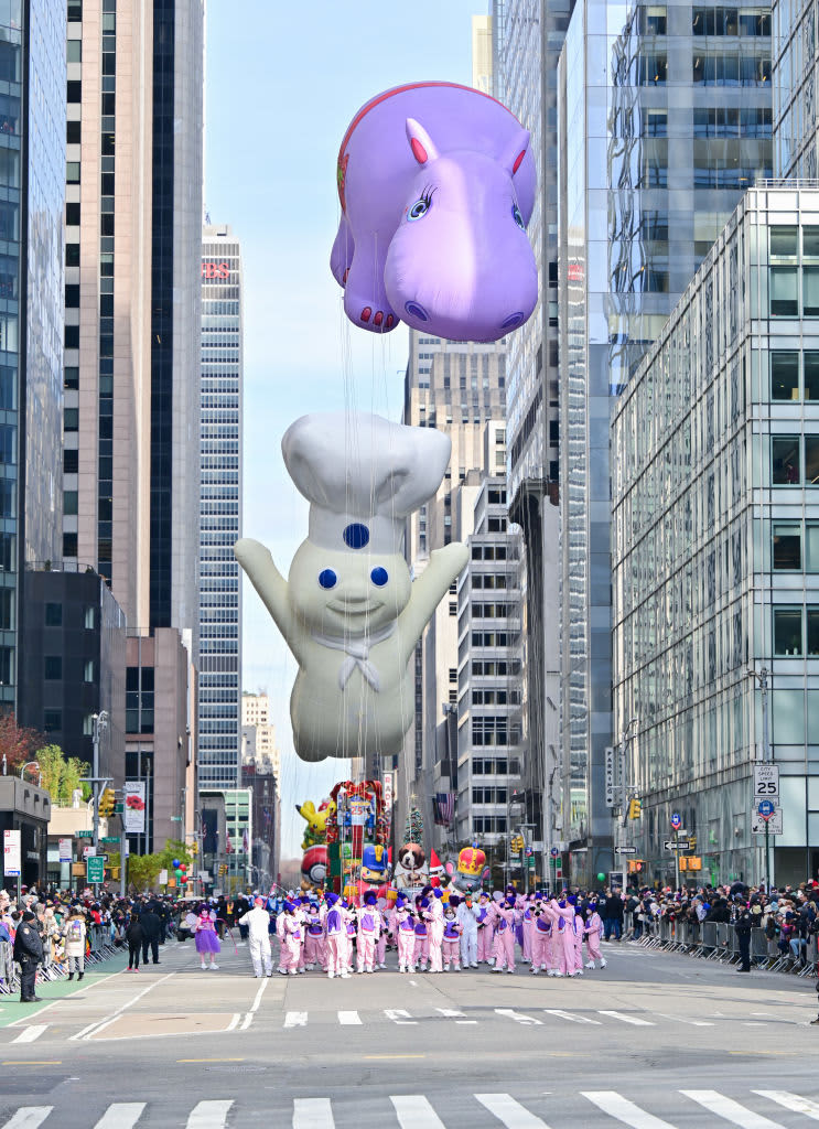NEW YORK, NEW YORK - NOVEMBER 25: View of the Pillsbury Doughboy and Happy Hippo balloons at the 95th Annual Macy's Thanksgiving Day Parade on November 25, 2021 in New York City. (Photo by James Devaney/Getty Images)