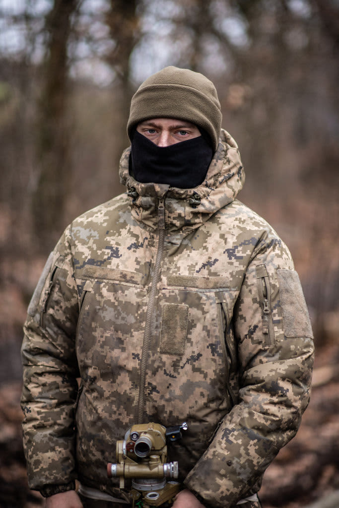 A Ukrainian soldier wearing a mask 