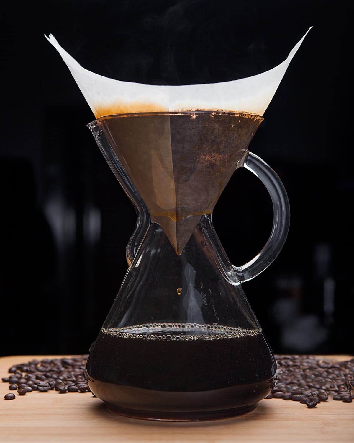 Coffee being filtered in large glass