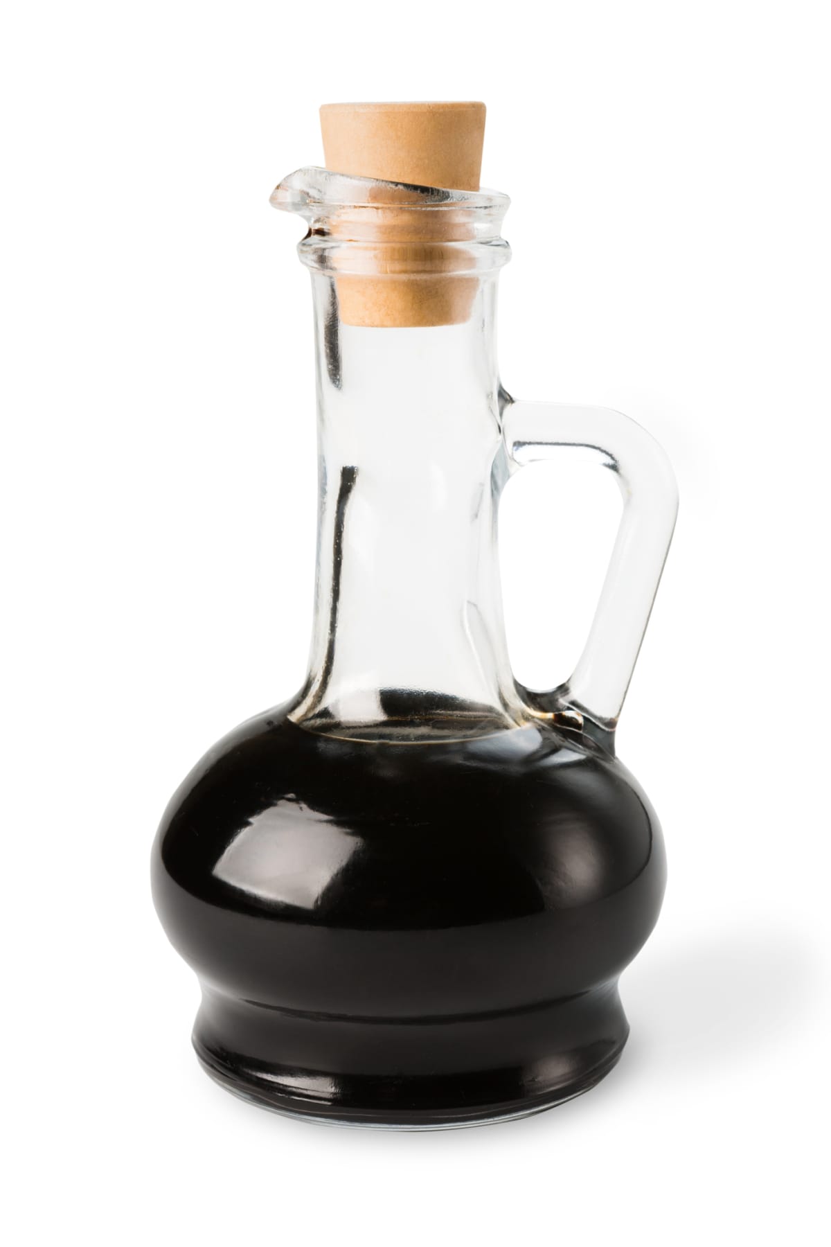 clear bottle of brown sauce with stopper