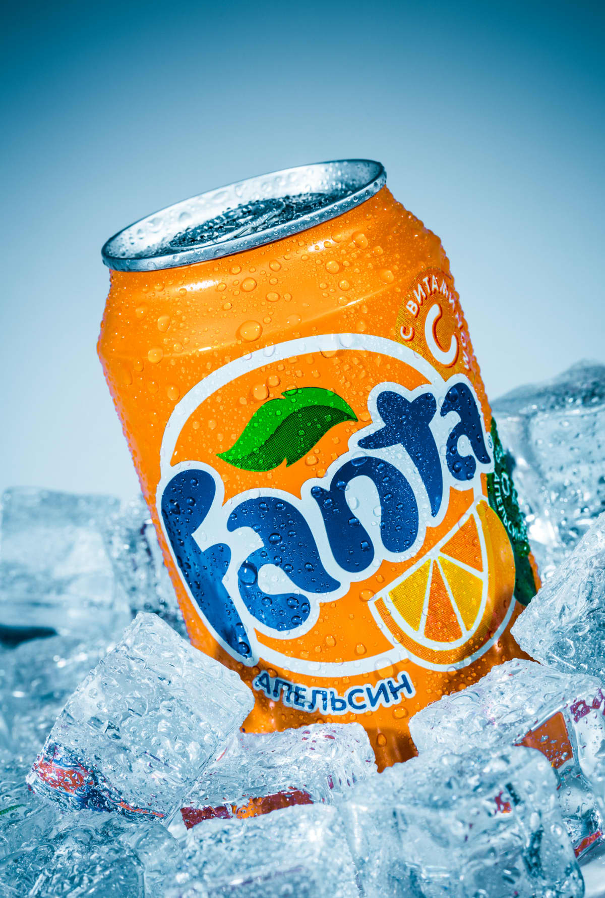 Moscow, Russia - April 3, 2014: Can of Coca Cola company soft drink Fanta Orange on ice. Fanta is a global brand of fruit-flavored carbonated soft drinks created by The Coca-Cola Company.
