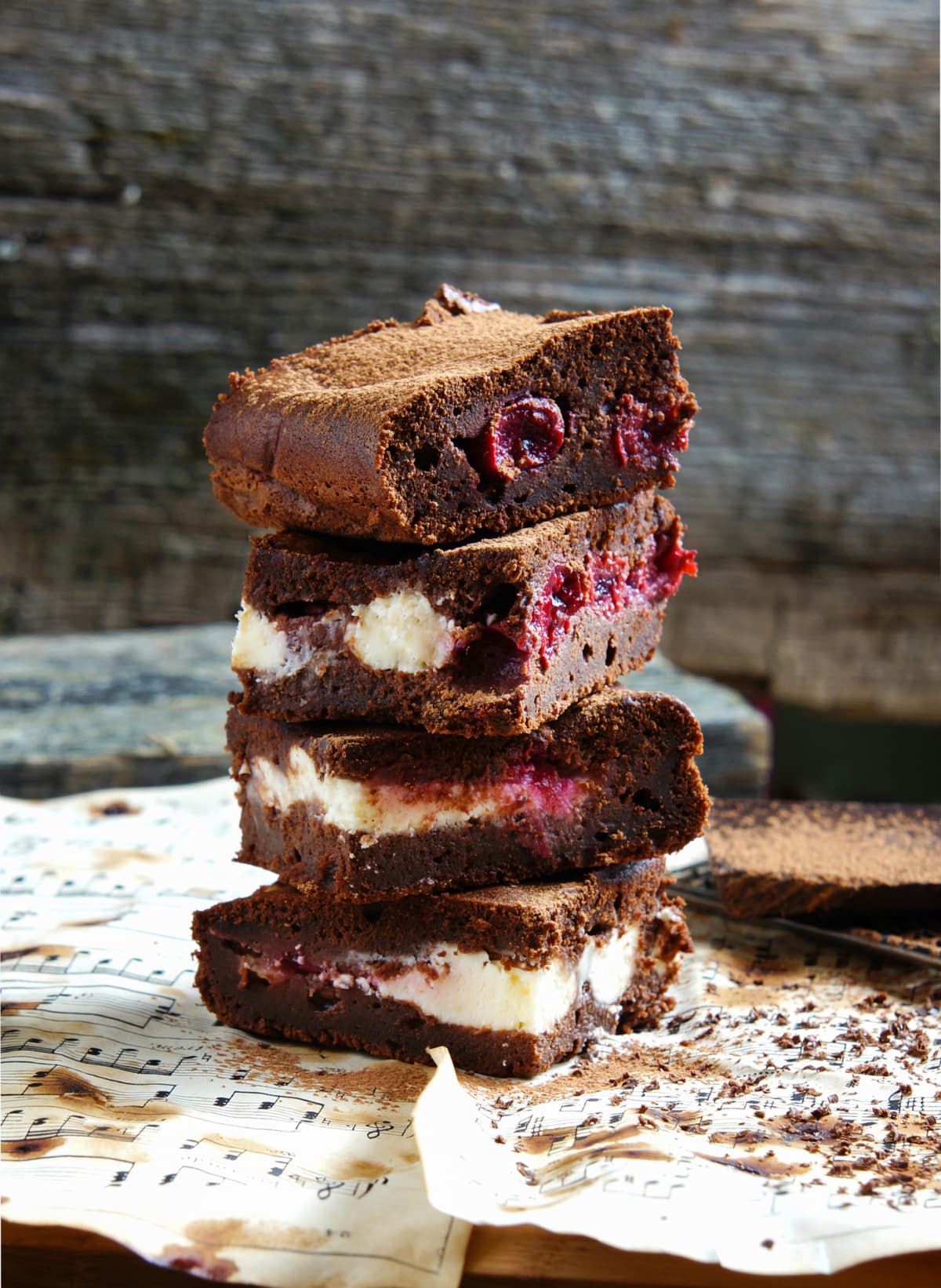 Chocolate brownie with cherry and cream
