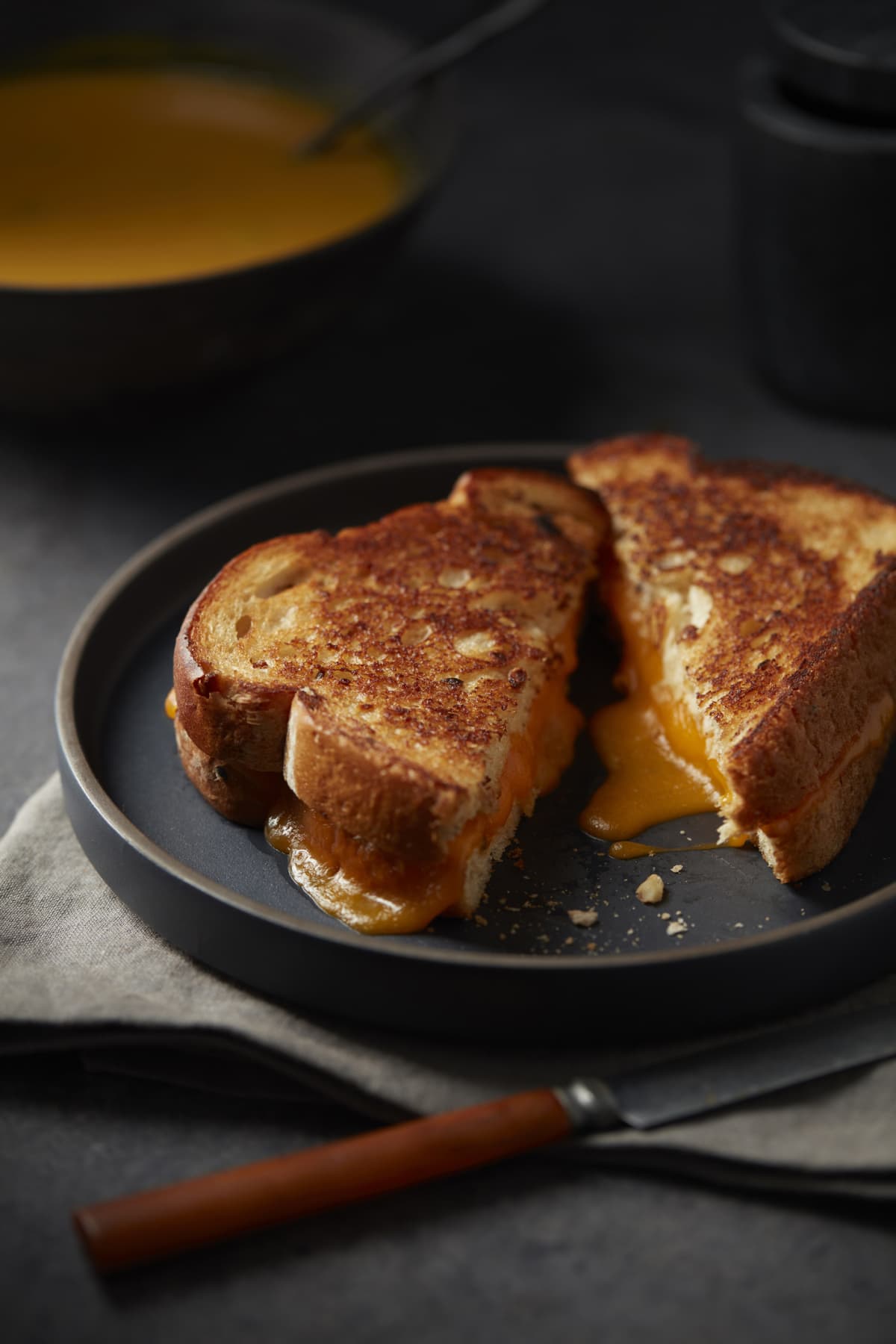 Grilled cheese sandwich in frying pan on stove
