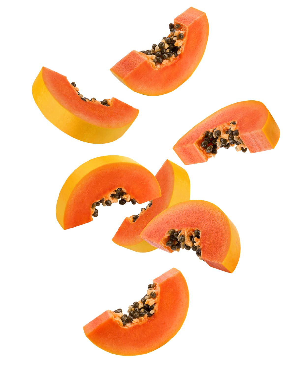 Falling papaya slice isolated on white background