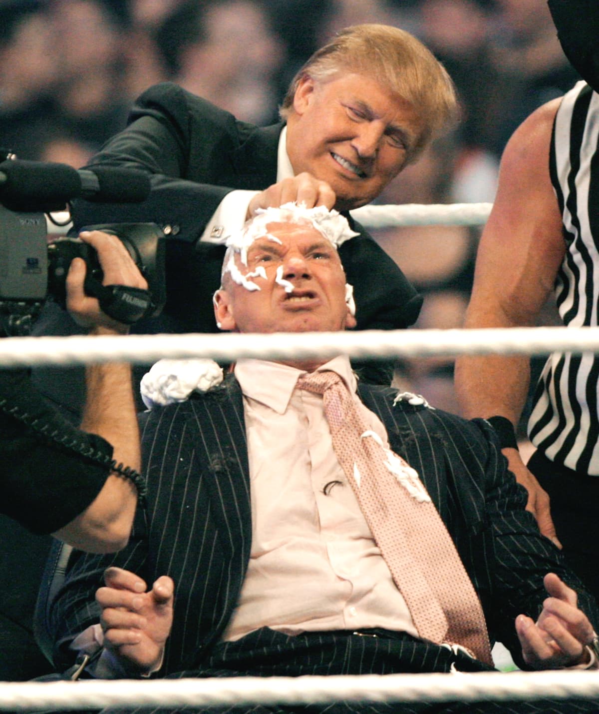 DETROIT - APRIL 1:  WWE chairman Vince McMahon (C) has his head shaved by Donald Trump after losing a bet in the Battle of the Billionaires at the 2007 World Wrestling Entertainment's Wrestlemania at Ford Field on April 1, 2007 in Detroit, Michigan. Umaga was representing McMahon in the match when he lost to Bobby Lashley who was representing Trump. (Photo by Bill Pugliano/Getty Images)
