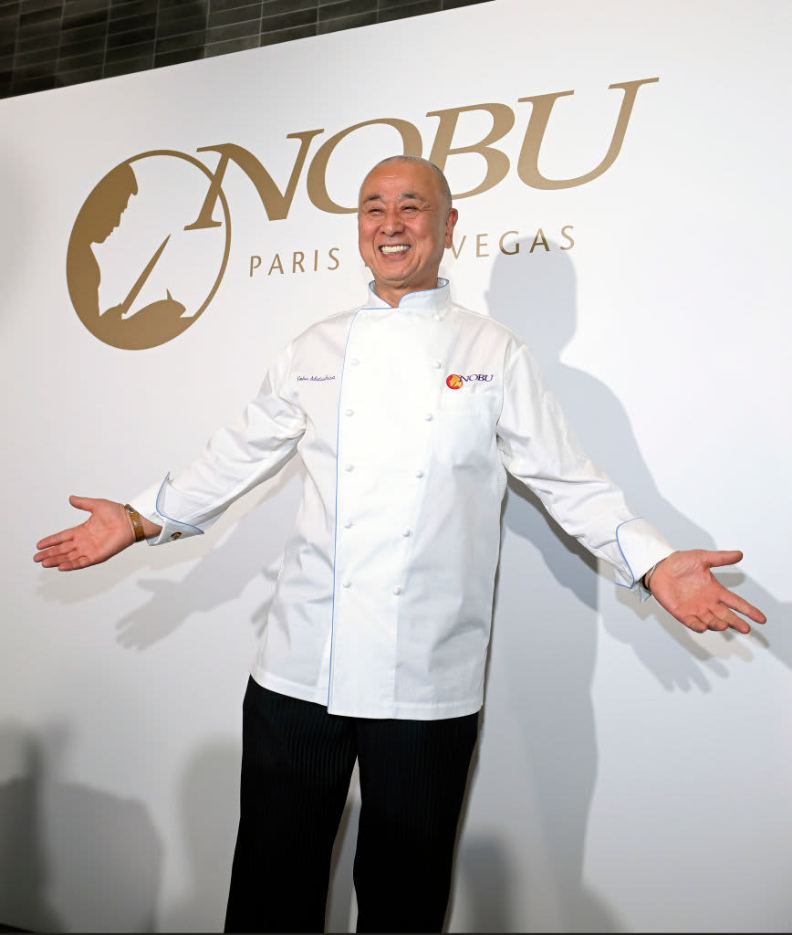 Chef Nobu smiling with open arms