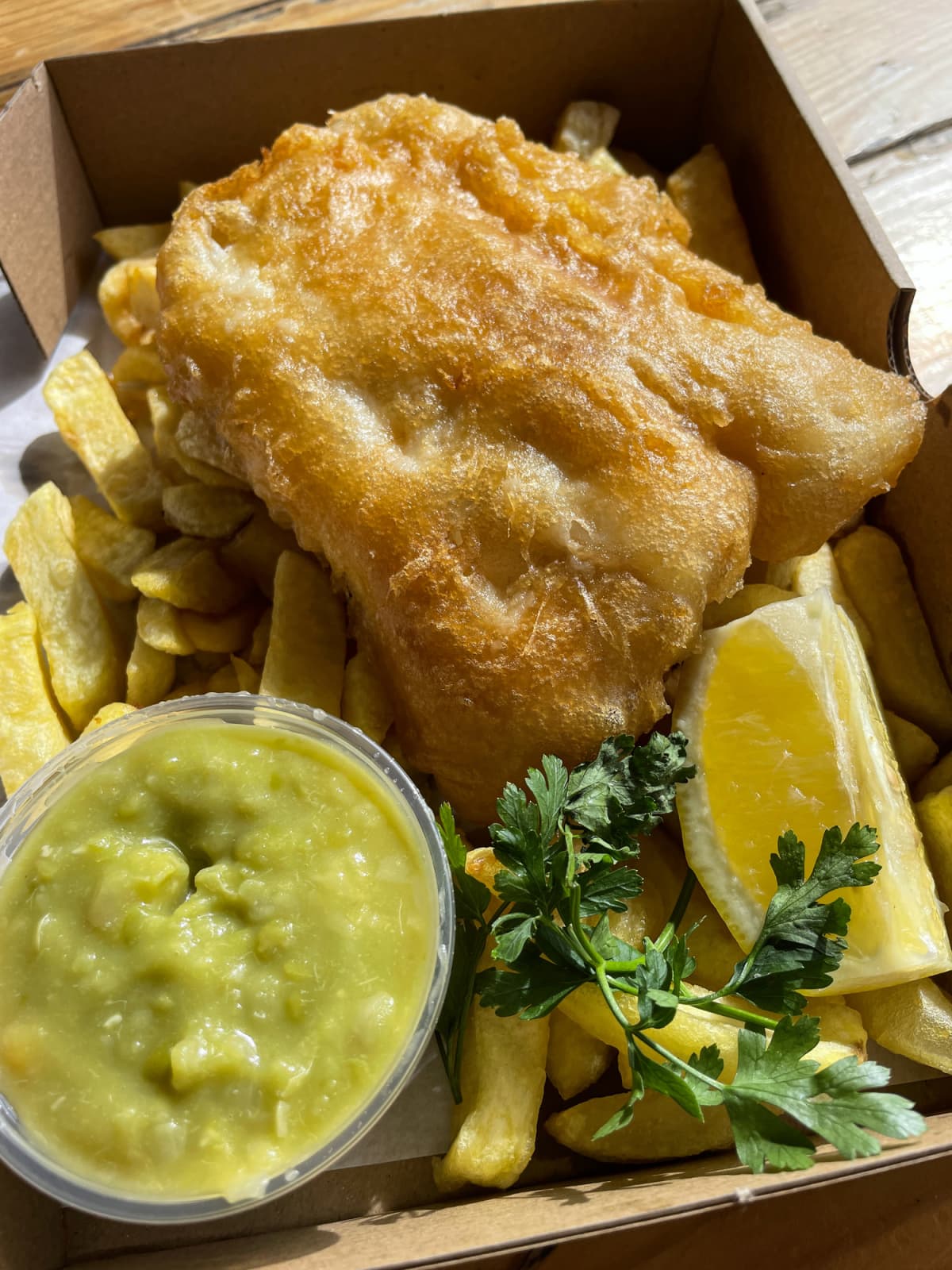 Fish and chips with green sauce