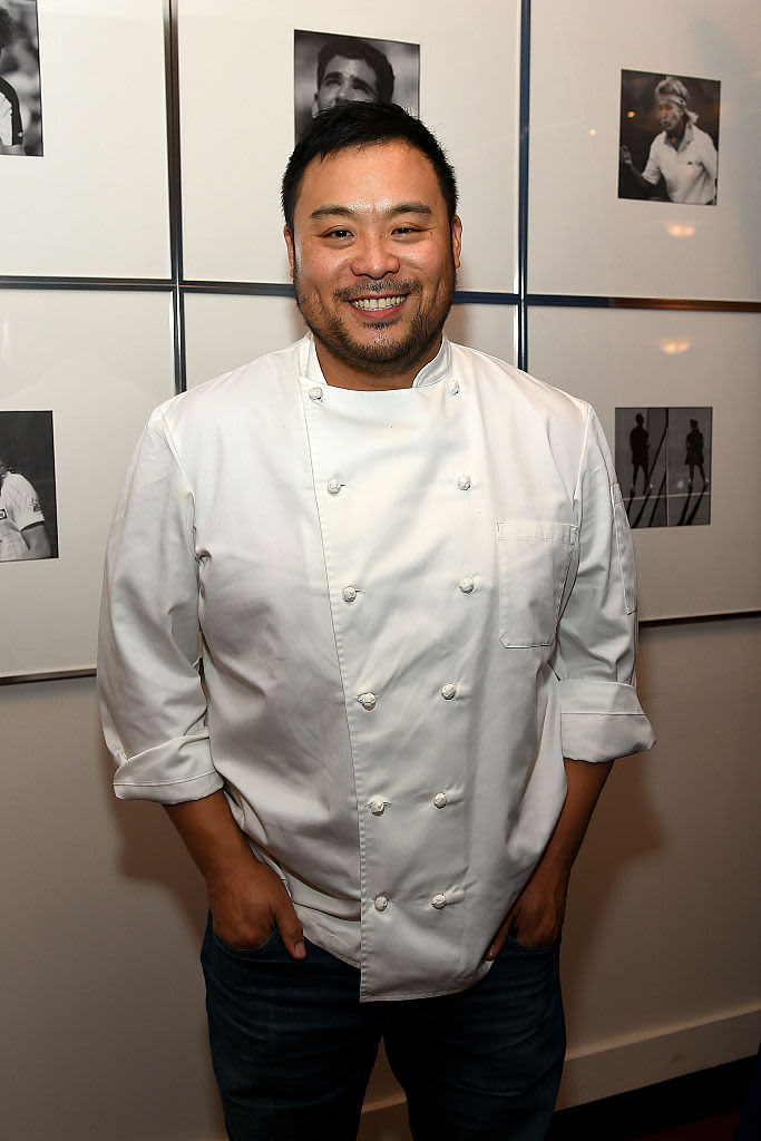 David chang in a chef's coat smiling