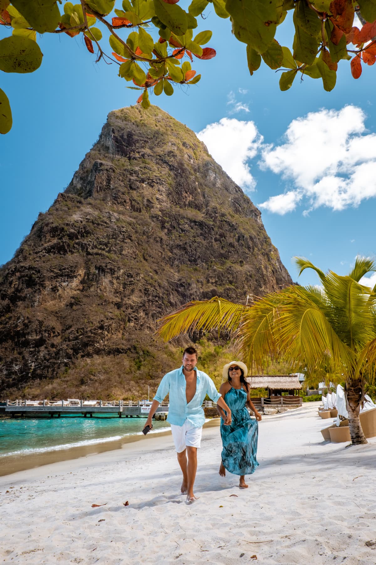 A couple enjoying the private beach at an all-inclusive resort in St. Lucia