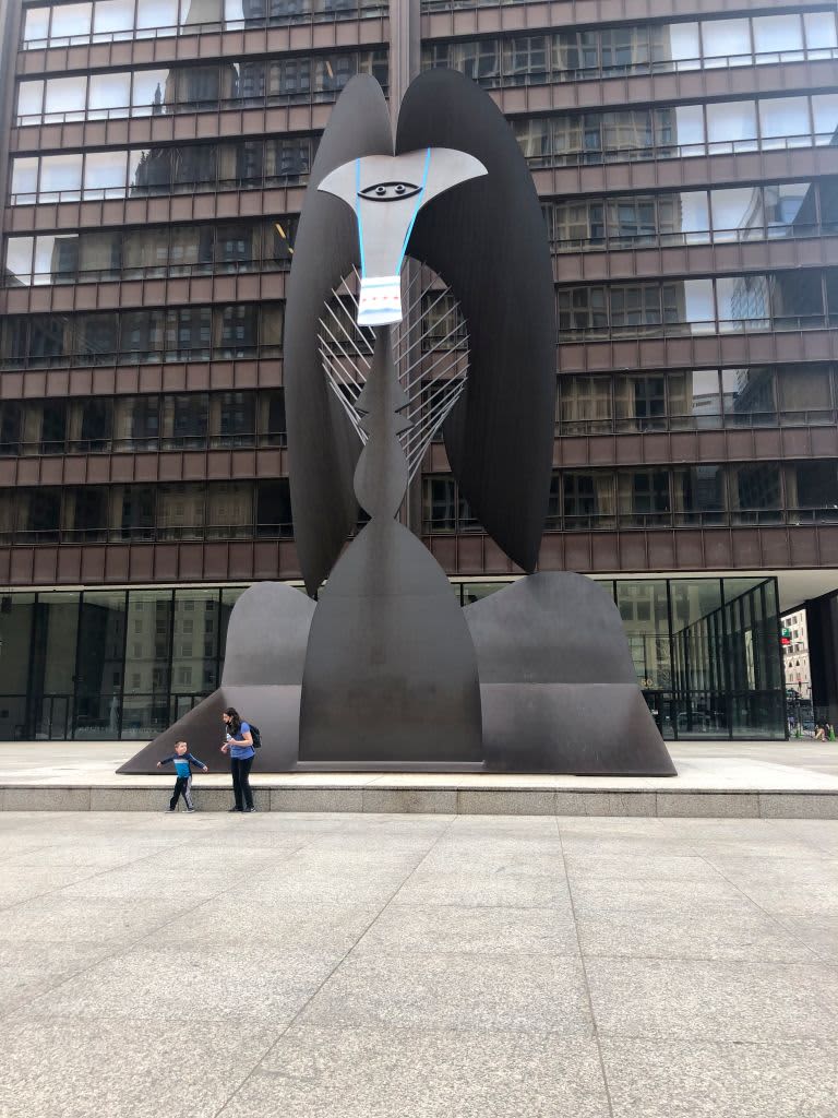 The Picasso sculpture with a face mask, Chicago, Illinois.