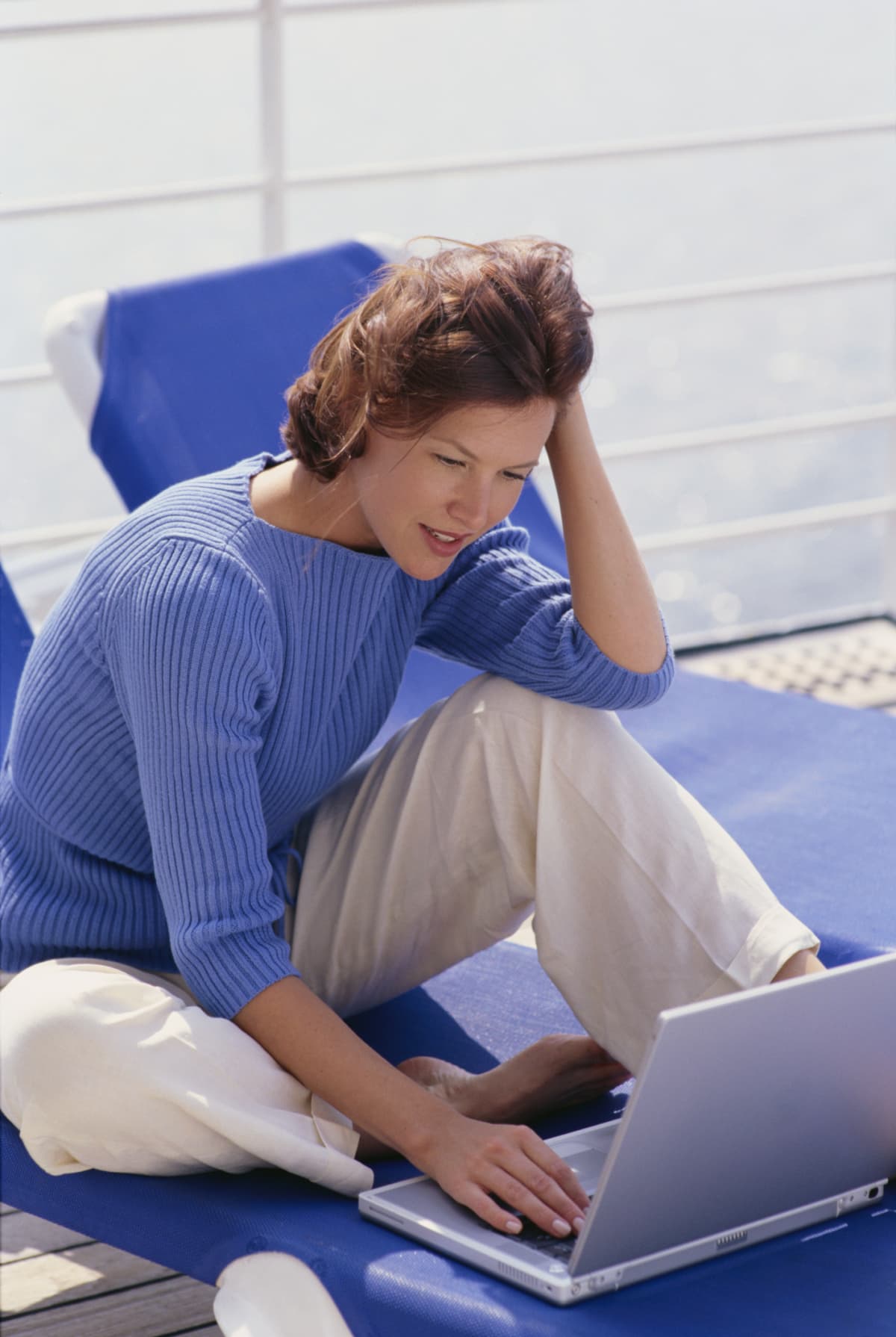 Woman using a laptop on a cruise