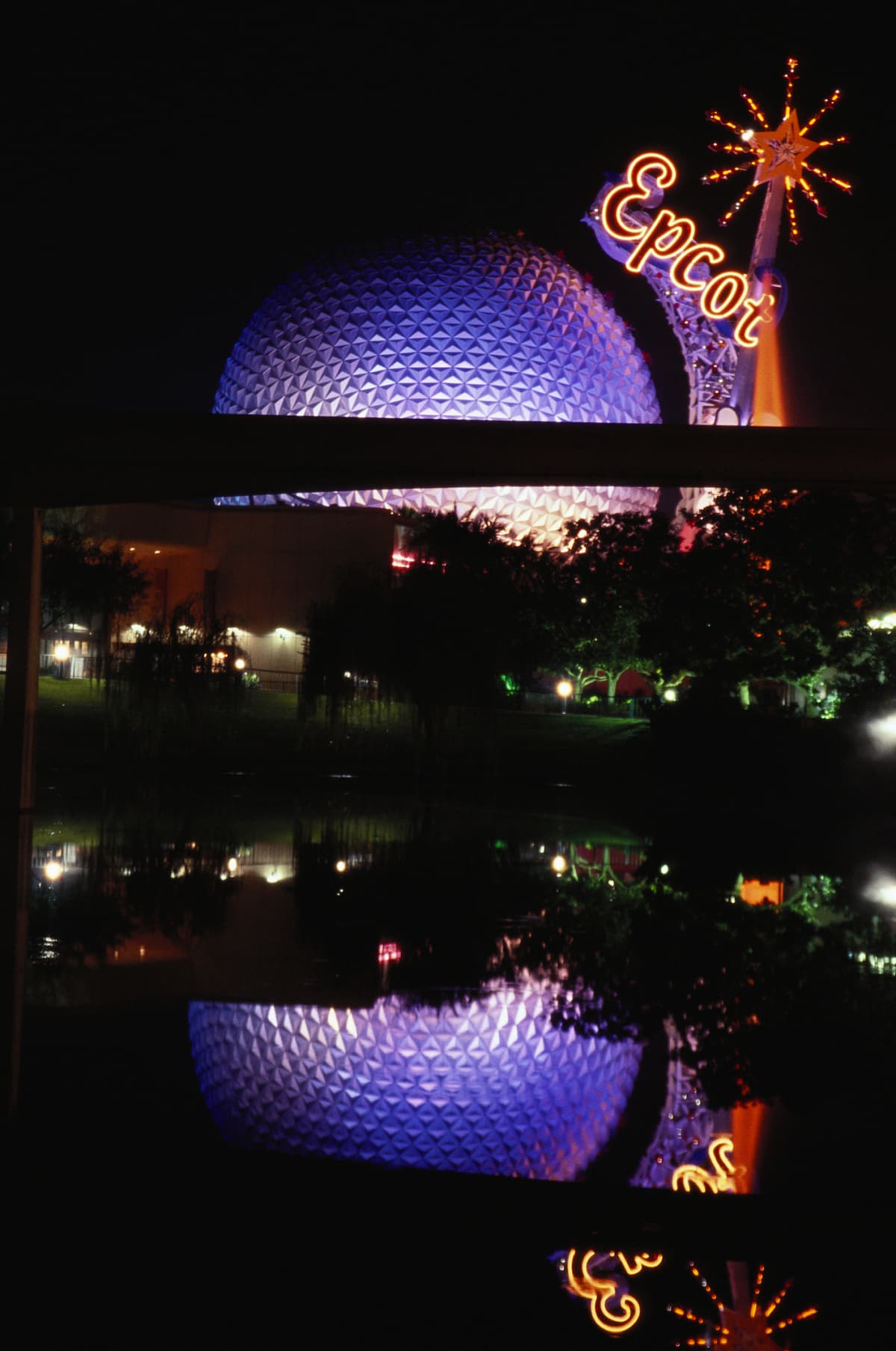 The geosphere Spaceship Earth at Epcot Center in Disney World is lit up at night.