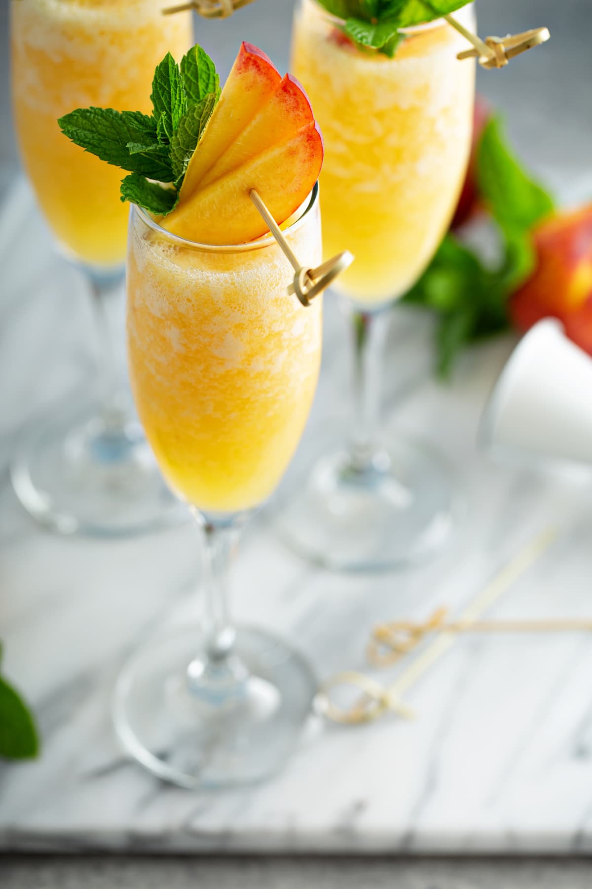 Peach mimosa or bellini cocktails for brunch