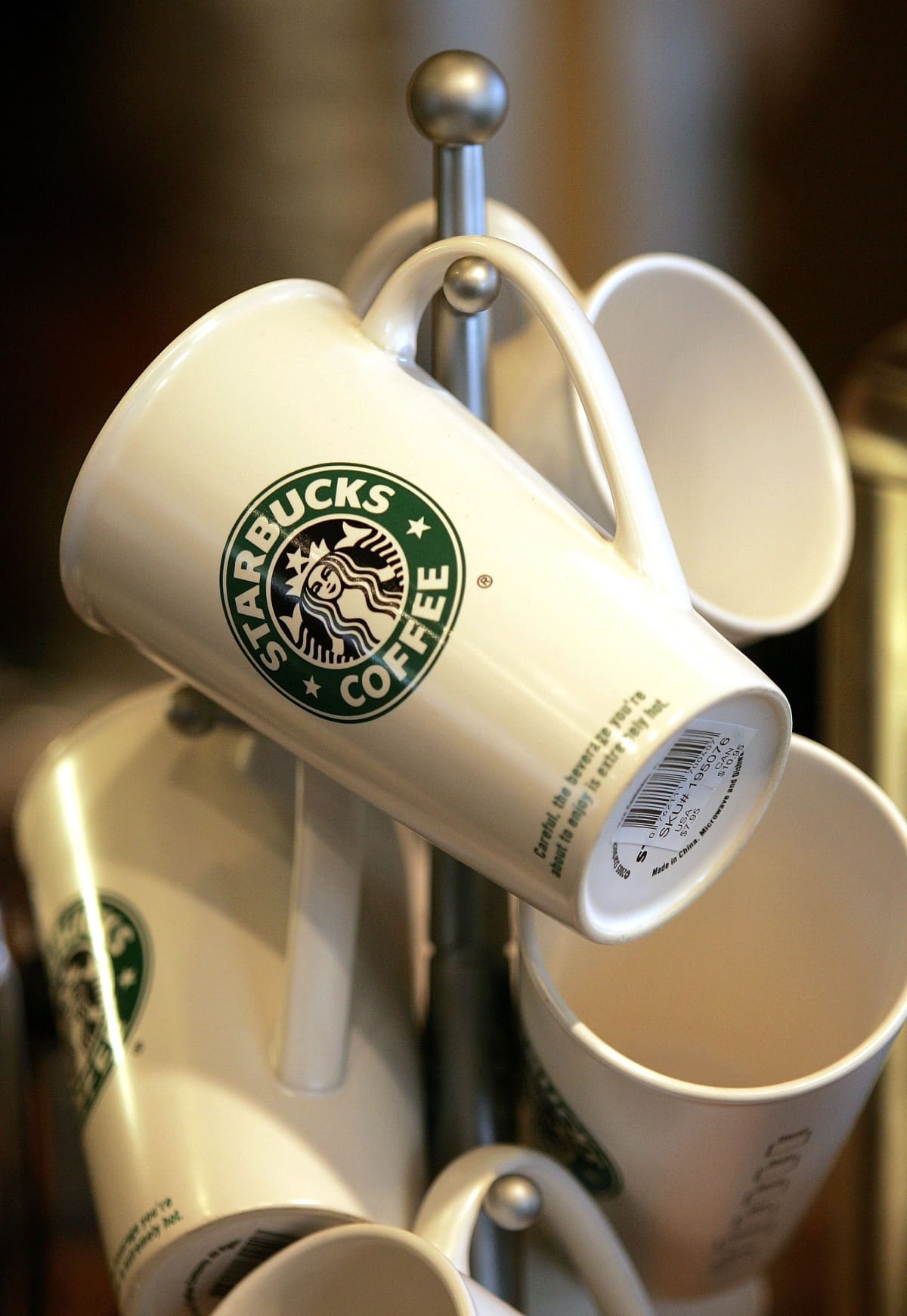 Starbucks coffee mugs are displayed for sale at a Starbucks store 