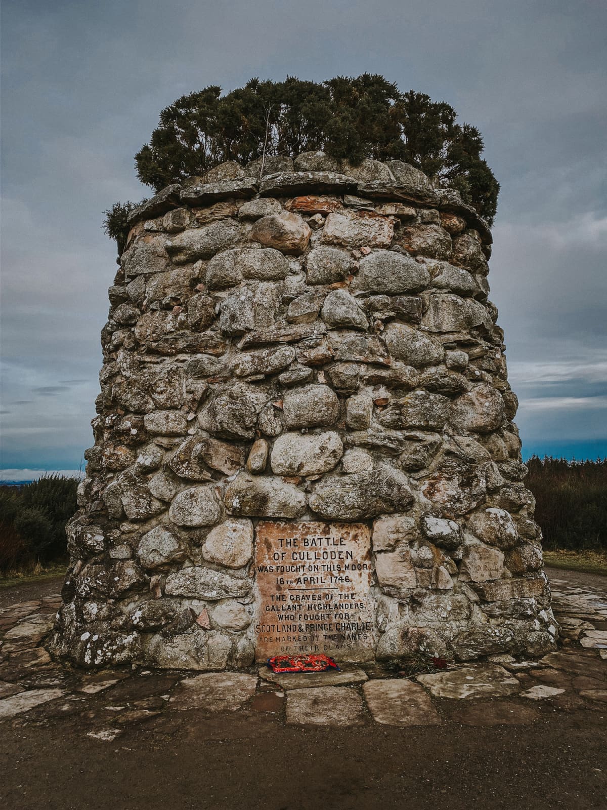 Looking north to battle Memorial Cairn in centre of Culloden Battlefield in Inverness, Scotland, UK