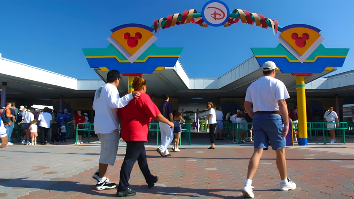 A man walks towards an entrance of Walt Disney World