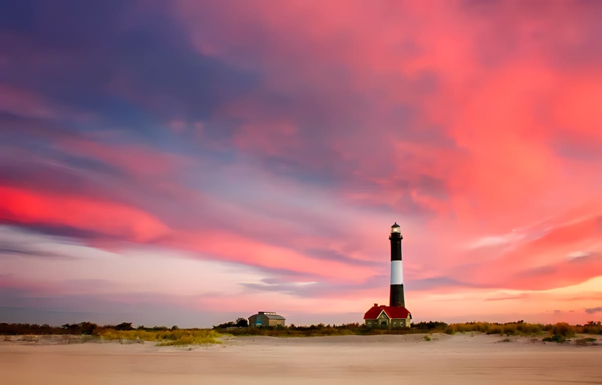 A lighthouse at sunset on Fire Island, New York