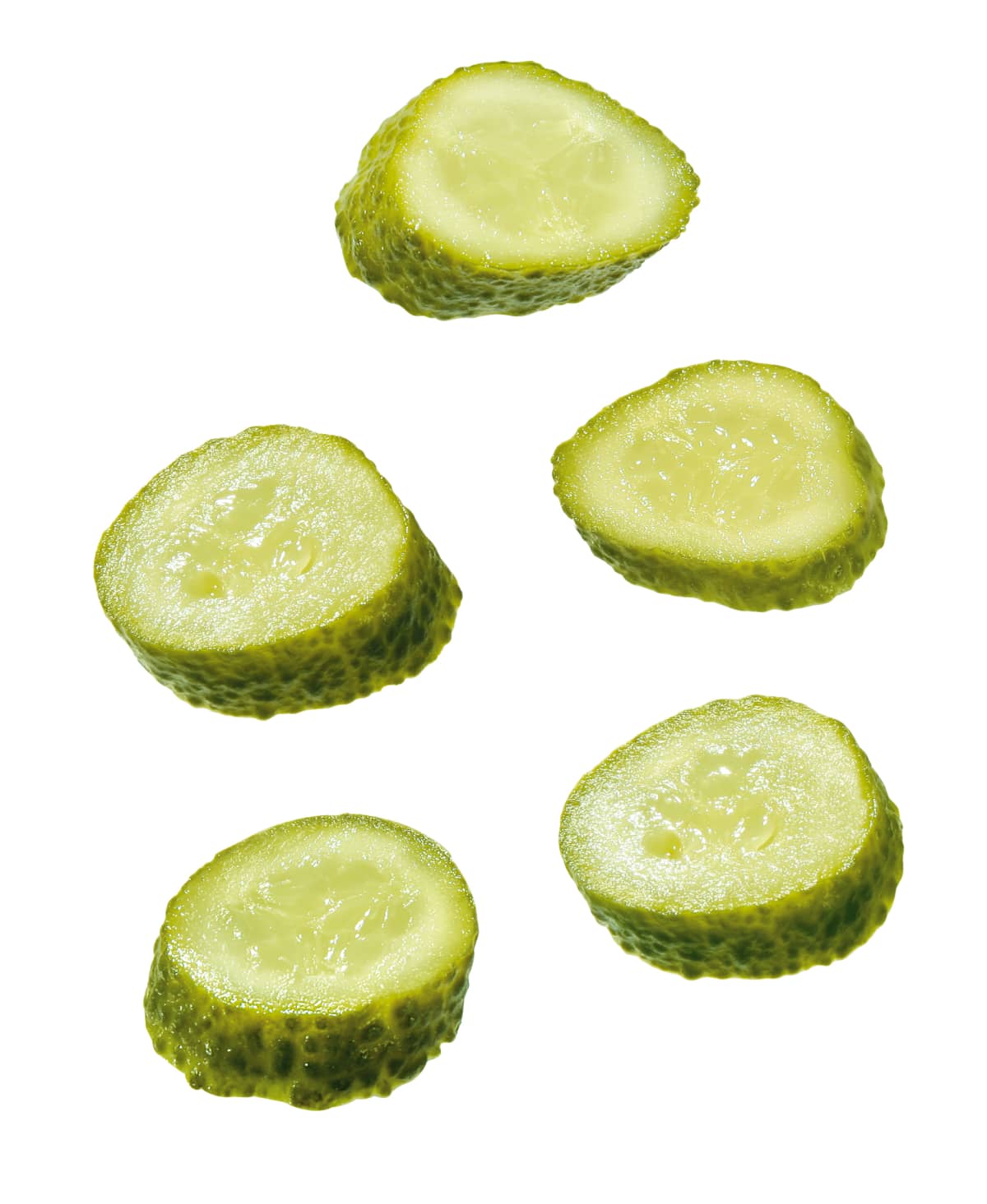 Sliced pickles on white background. 