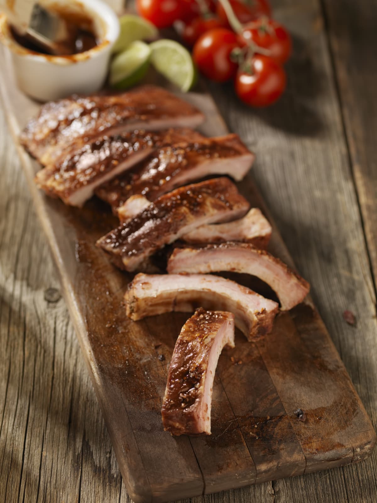 Slices of cooked pork on cutting board