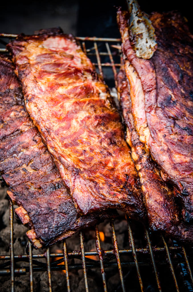 Barbecue Racks of Ribs on Grill. (Photo by: GHI/Education Images/Universal Images Group via Getty Images)