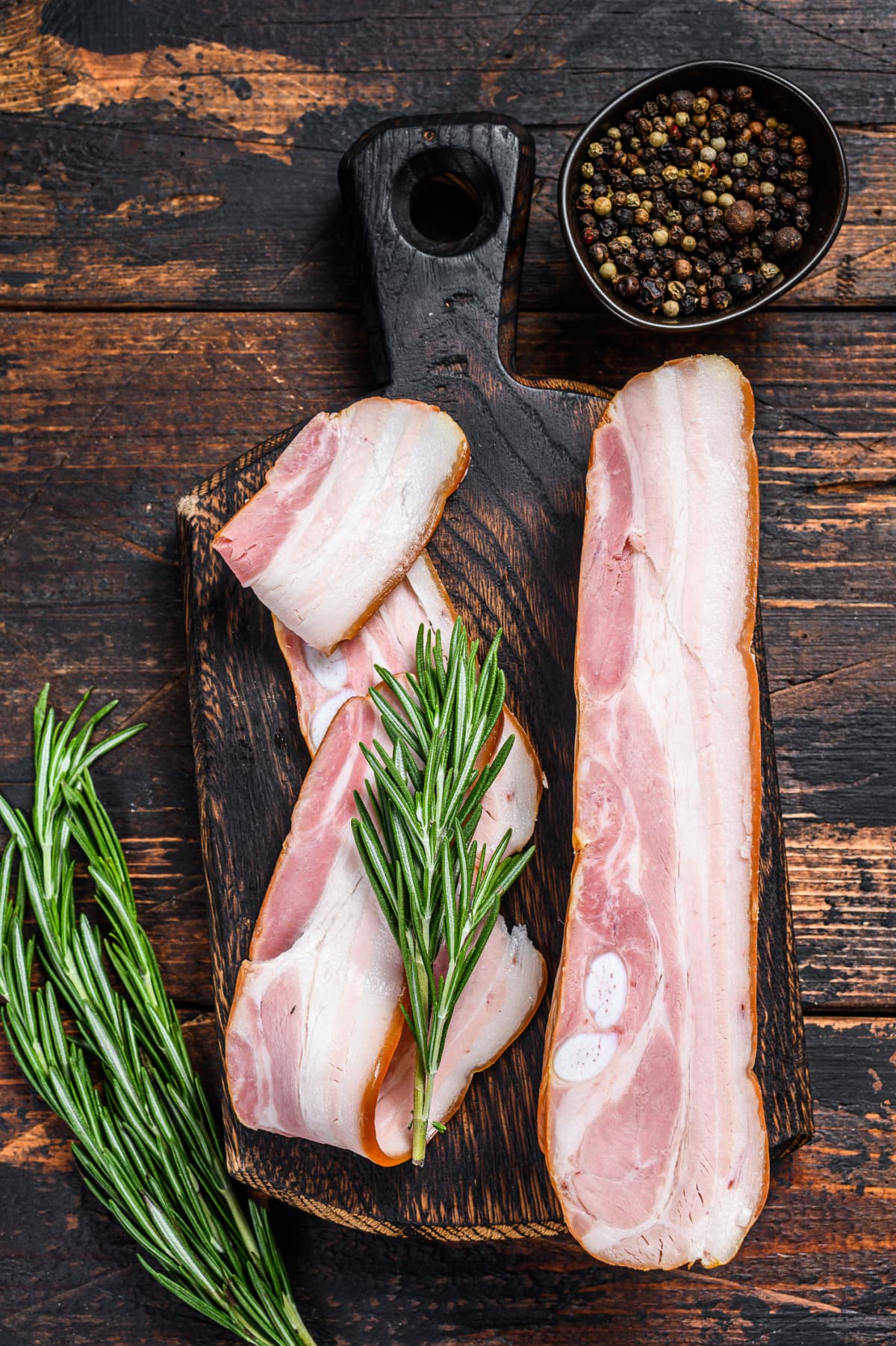 Raw pork belly on a cutting board