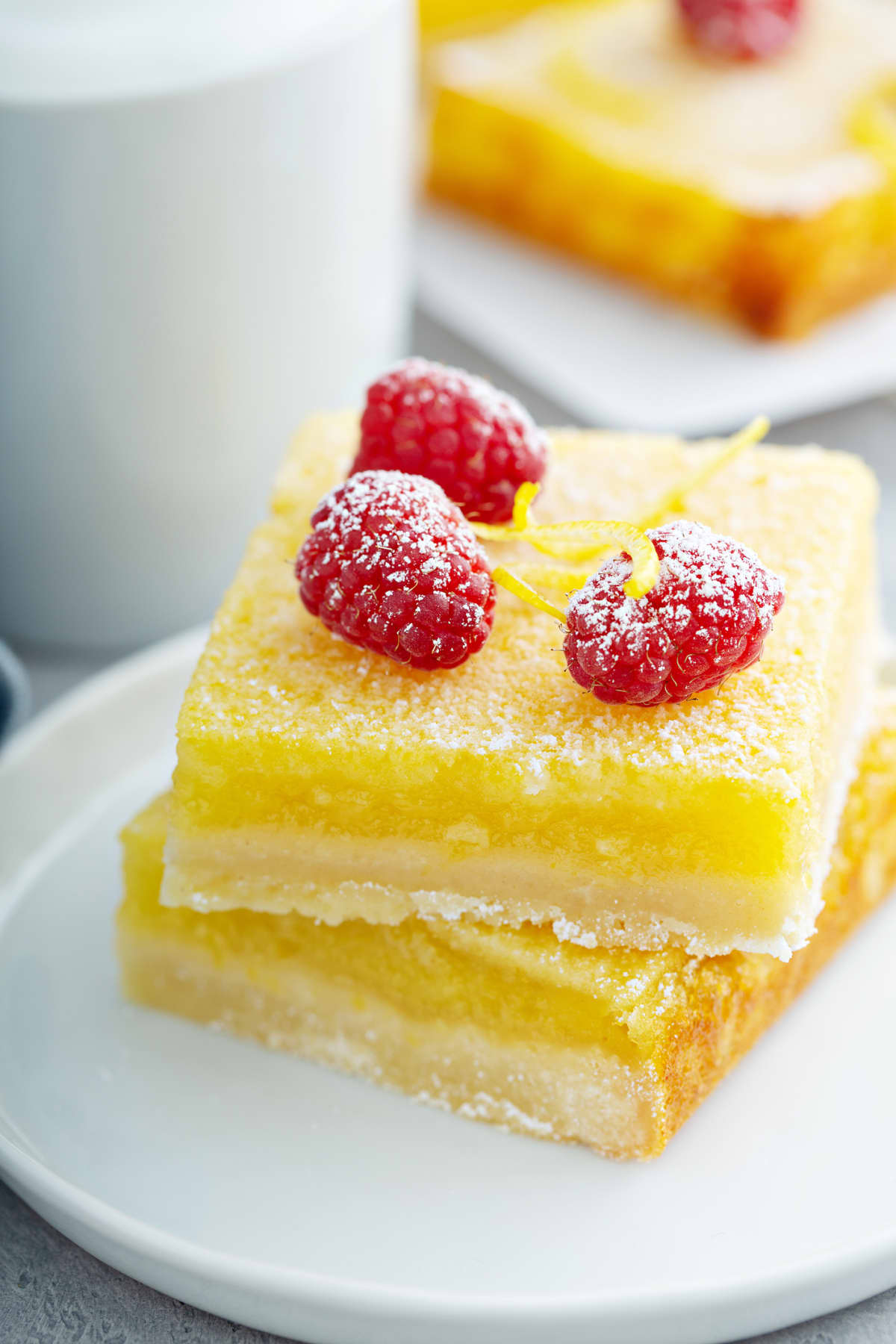 Lemon bar dessert with berries on top
