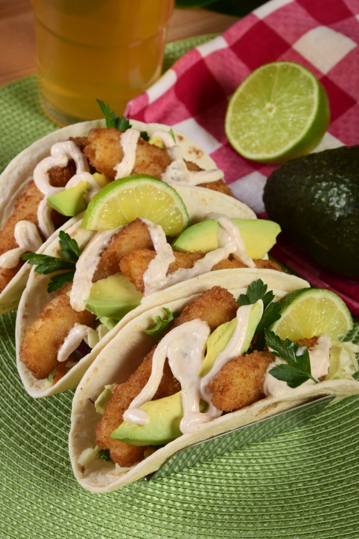 Three Baja fish tacos served with lime