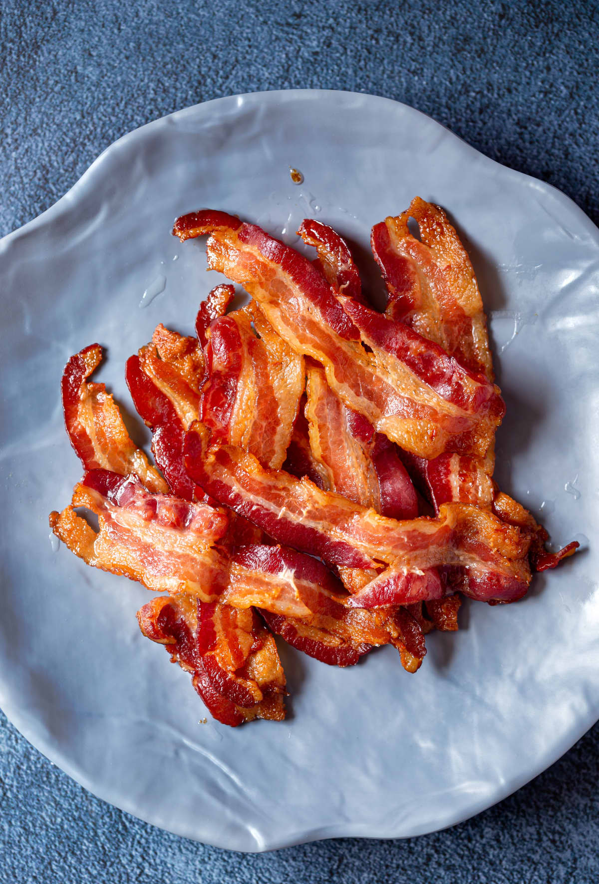 A pile of bacon on a plate
